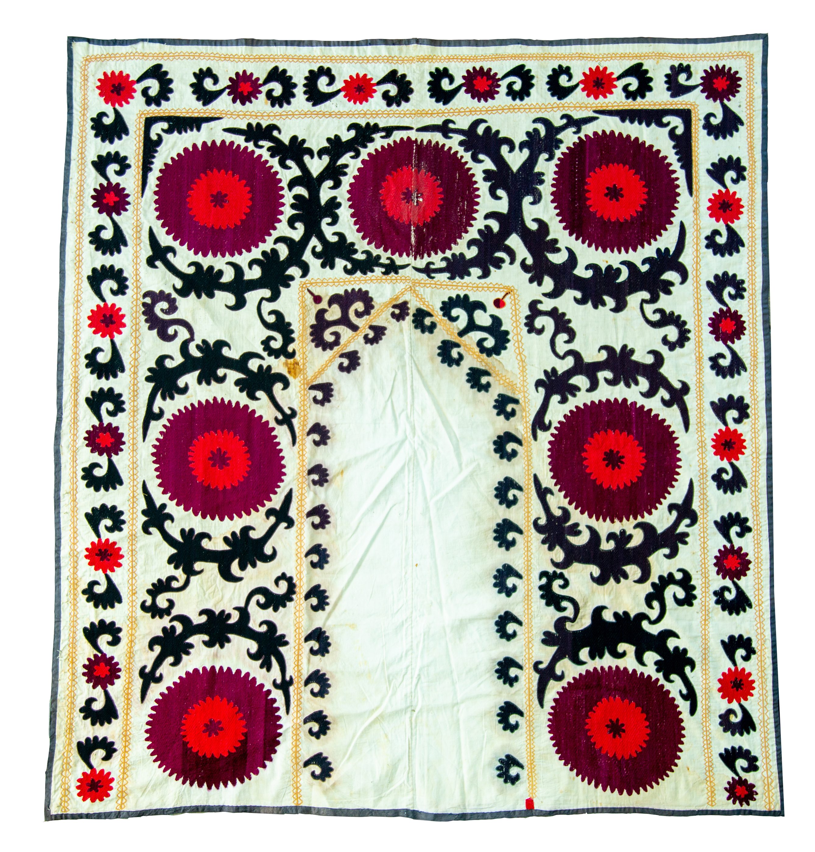 Split panel with crimson roundels — suzani, Zarafshon valley